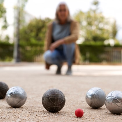 elderly friends playing petanque