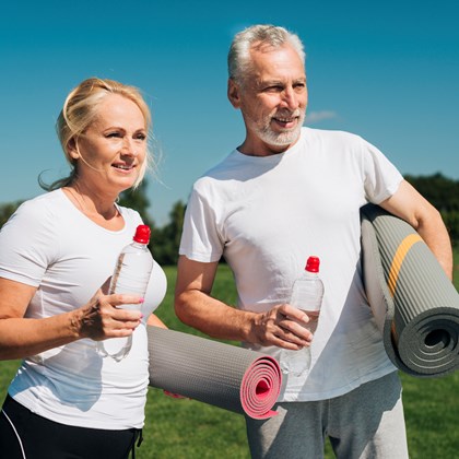 medium shot old people with water bottles